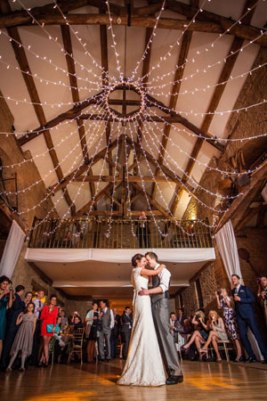 image: Jo & Mark's first dance at The Great Tythe Barn, Tetbury.